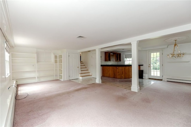 11 Macintosh Dr, Smithfield, RI 02828 - unfurnished living room with light colored carpet, a baseboard radiator, stairs, a chandelier, and baseboard heating