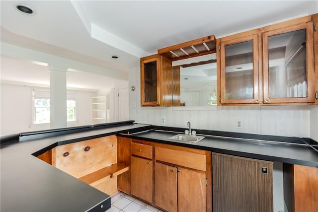 11 Macintosh Dr, Smithfield, RI 02828 - kitchen featuring dark countertops, glass insert cabinets, brown cabinetry, and light tile patterned floors