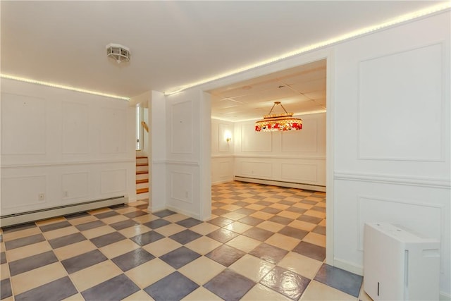 11 Macintosh Dr, Smithfield, RI 02828 - spare room featuring a decorative wall, a baseboard radiator, baseboard heating, stairway, and light floors