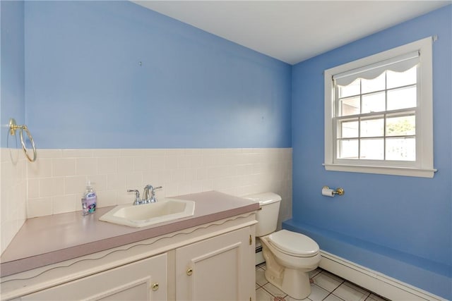 11 Macintosh Dr, Smithfield, RI 02828 - half bathroom featuring a baseboard heating unit, tile patterned flooring, and vanity