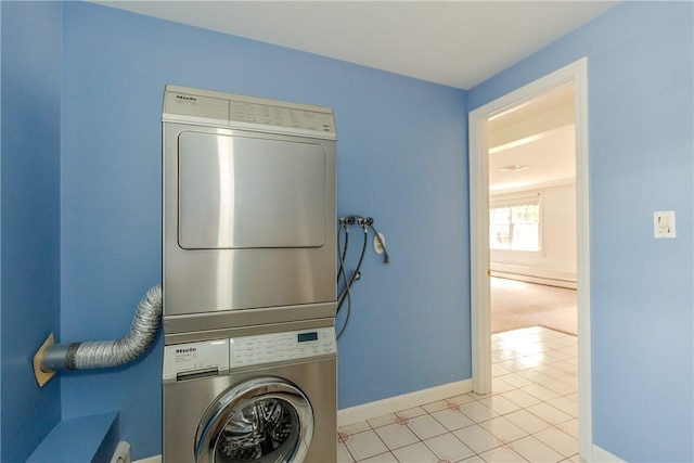 11 Macintosh Dr, Smithfield, RI 02828 - laundry area with stacked washer / dryer and light tile patterned floors
