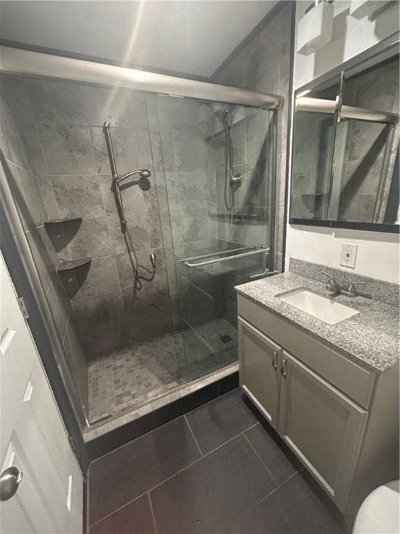 25 Bullocks Point Ave Unit 5C, East Providence, RI 02915 - bathroom with vanity, a stall shower, and tile patterned floors
