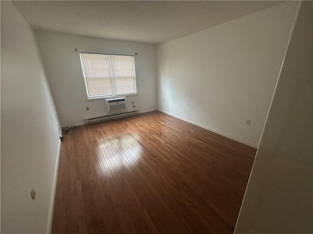 25 Bullocks Point Ave Unit 5C, East Providence, RI 02915 - spare room featuring wood finished floors, a baseboard radiator, and an AC wall unit