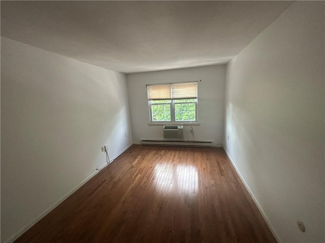 25 Bullocks Point Ave Unit 5C, East Providence, RI 02915 - unfurnished room with baseboard heating, wood finished floors, and a wall mounted AC