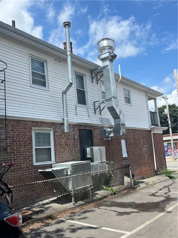 877 Central Ave, Pawtucket, RI 02861 - rear view of property with brick siding