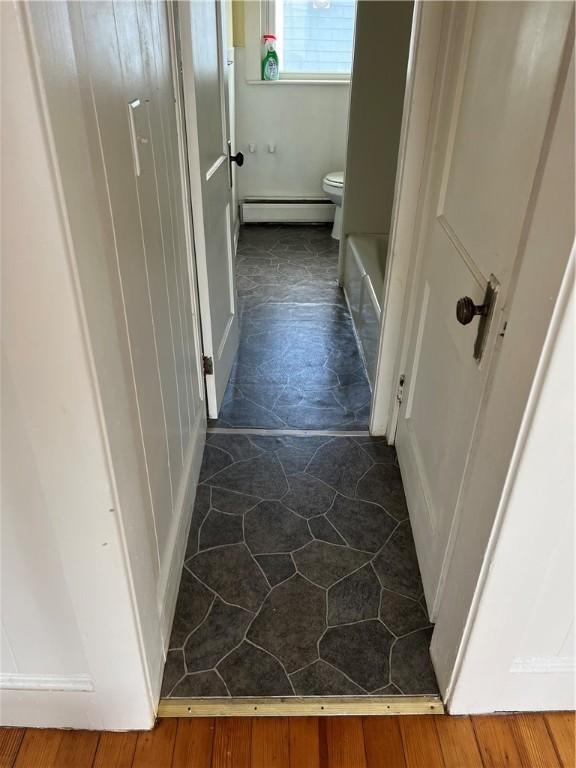 877 Central Ave, Pawtucket, RI 02861 - corridor featuring a baseboard heating unit