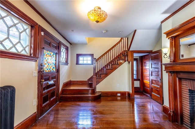 192 Lenox Ave, Providence, RI 02907 - entryway with stairway, wood finished floors, and a brick fireplace