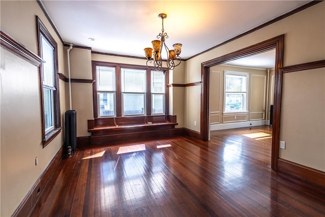 192 Lenox Ave, Providence, RI 02907 - unfurnished dining area featuring a chandelier, hardwood / wood-style flooring, and ornamental molding