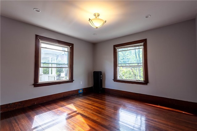 192 Lenox Ave, Providence, RI 02907 - unfurnished room with radiator heating unit and wood finished floors