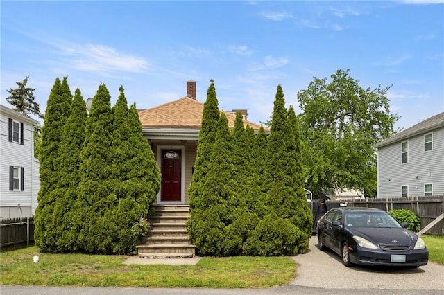 22 Parsons Ave, East Providence, RI 02914 - view of property hidden behind natural elements with a chimney