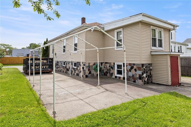 22 Parsons Ave, East Providence, RI 02914 - back of property with a chimney