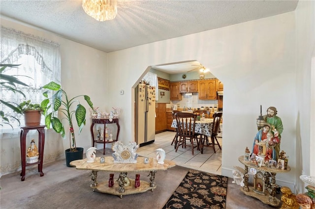 22 Parsons Ave, East Providence, RI 02914 - living area featuring arched walkways and a textured ceiling