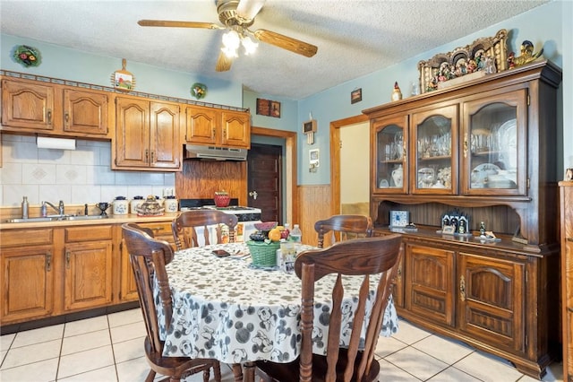 22 Parsons Ave, East Providence, RI 02914 - dining space featuring a textured ceiling, a ceiling fan, light tile patterned floors, and a wainscoted wall