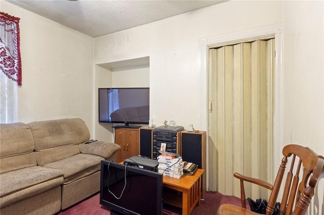 22 Parsons Ave, East Providence, RI 02914 - living area with dark colored carpet and a textured ceiling