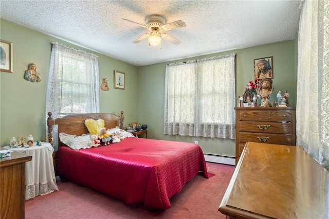 22 Parsons Ave, East Providence, RI 02914 - carpeted bedroom featuring a baseboard heating unit, a textured ceiling, and ceiling fan