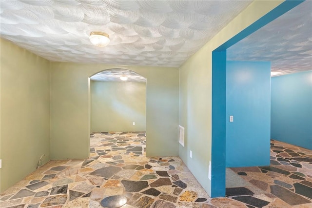 22 Parsons Ave, East Providence, RI 02914 - corridor with stone flooring and arched walkways