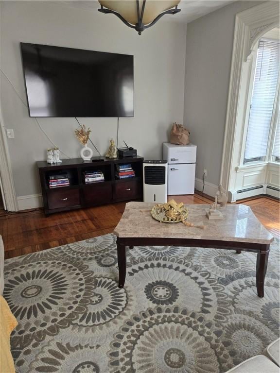 45 Harrison St, Pawtucket, RI 02860 - living area featuring wood finished floors and a baseboard heating unit
