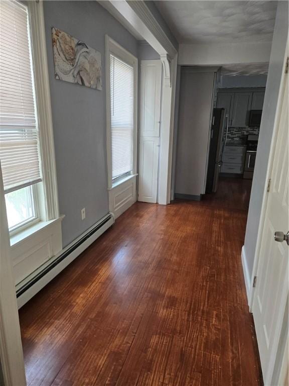 45 Harrison St, Pawtucket, RI 02860 - corridor with a baseboard heating unit and dark wood-style flooring