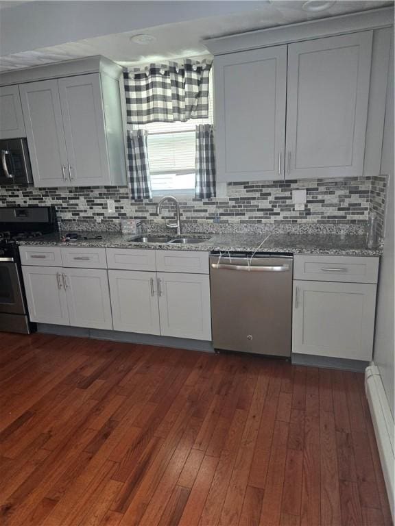45 Harrison St, Pawtucket, RI 02860 - kitchen with stainless steel appliances, dark wood-type flooring, backsplash, and stone counters
