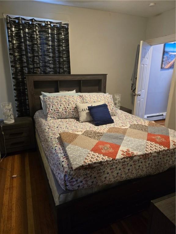 45 Harrison St, Pawtucket, RI 02860 - bedroom featuring baseboard heating and wood finished floors