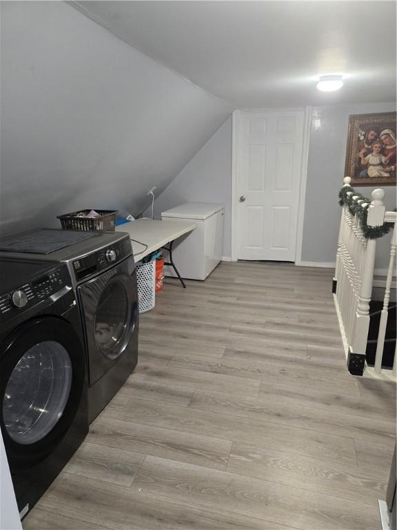 45 Harrison St, Pawtucket, RI 02860 - laundry room with light wood-style flooring and washing machine and clothes dryer