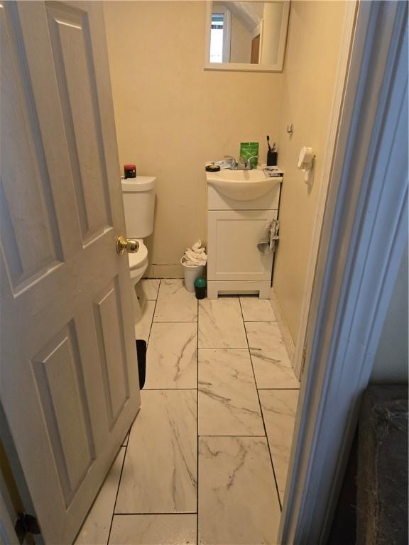 45 Harrison St, Pawtucket, RI 02860 - half bathroom featuring vanity and marble finish flooring