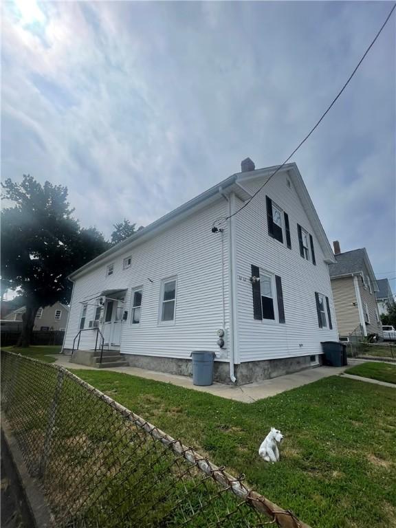 61 Maple Ave, Johnston, RI 02919 - view of side of property featuring a chimney