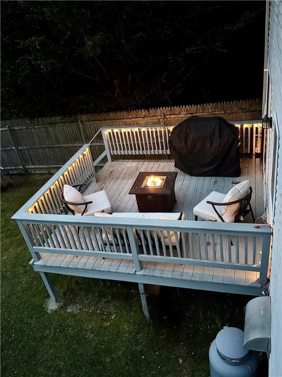 8 Orchard St, West Warwick, RI 02893 - wooden terrace featuring a fire pit and grilling area