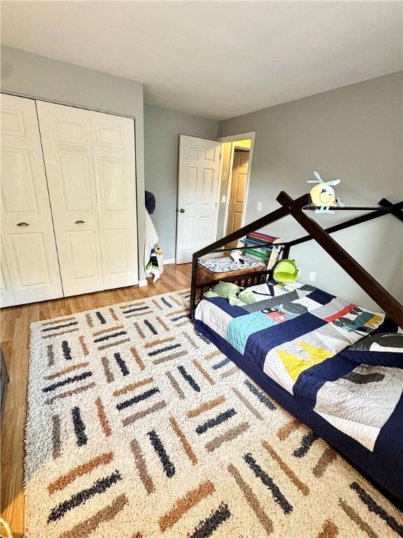 8 Orchard St, West Warwick, RI 02893 - bedroom with light wood-style floors and a closet