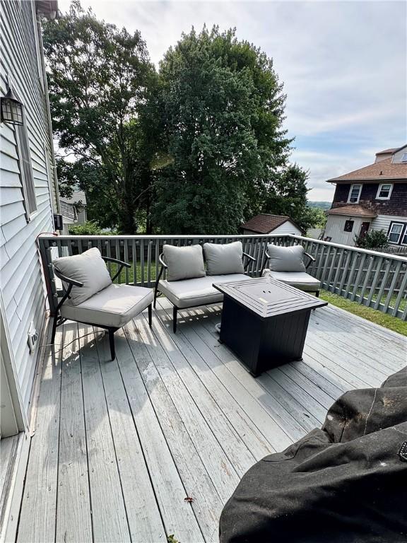 8 Orchard St, West Warwick, RI 02893 - wooden terrace with an outdoor hangout area