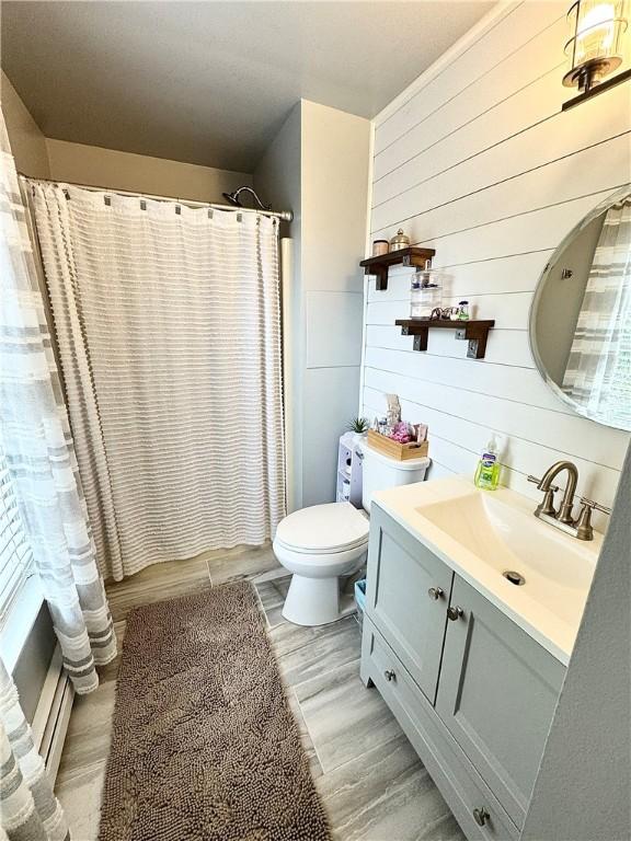 8 Orchard St, West Warwick, RI 02893 - full bath featuring vanity, wooden walls, a shower with curtain, and wood finished floors