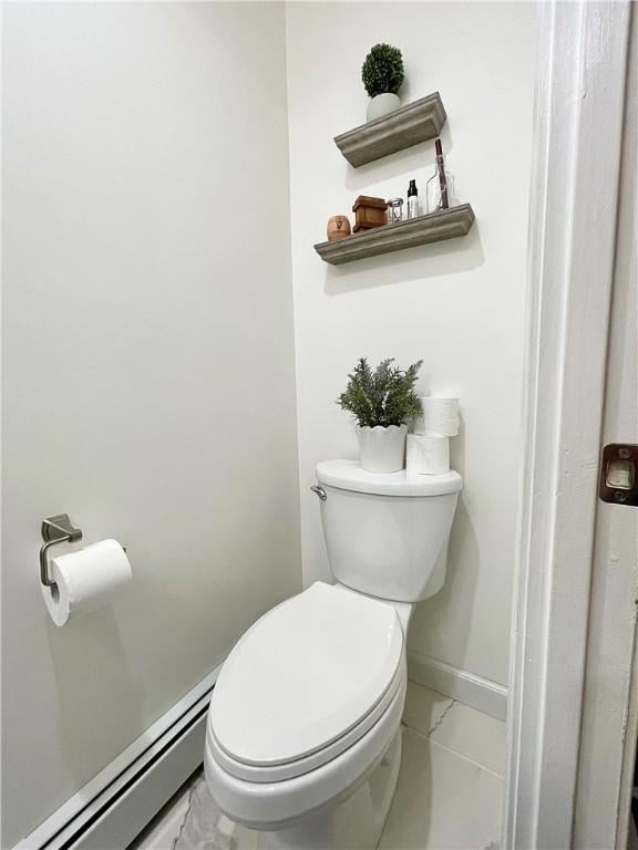 8 Orchard St, West Warwick, RI 02893 - bathroom featuring a baseboard radiator and marble look tile flooring