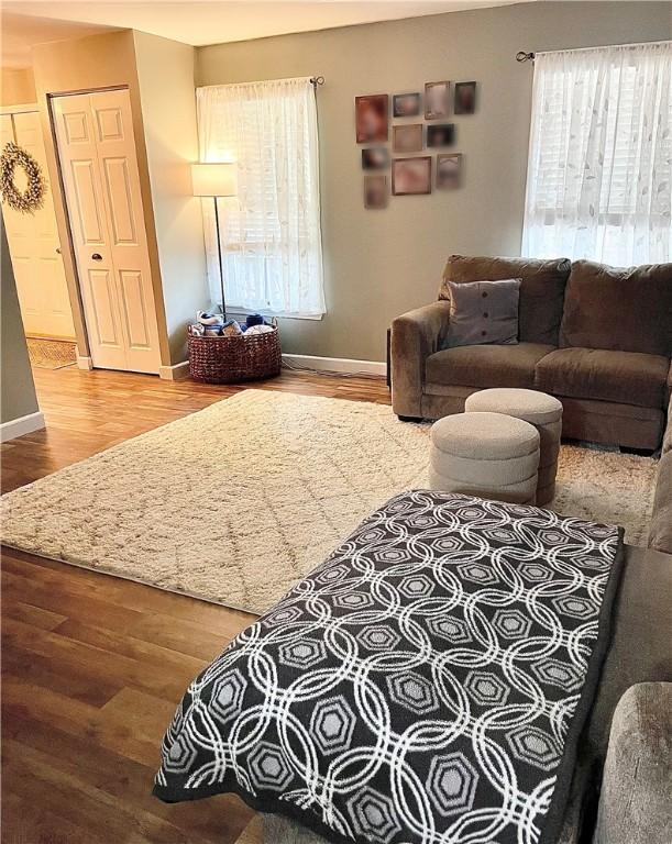 8 Orchard St, West Warwick, RI 02893 - living area with healthy amount of natural light and wood finished floors