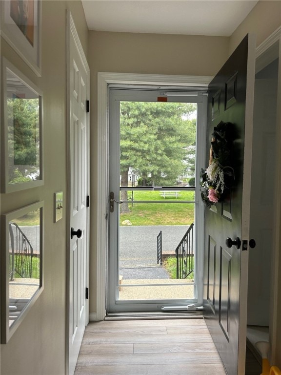 565 Quaker Ln Unit 101, West Warwick, RI 02893 - doorway to outside with light wood finished floors