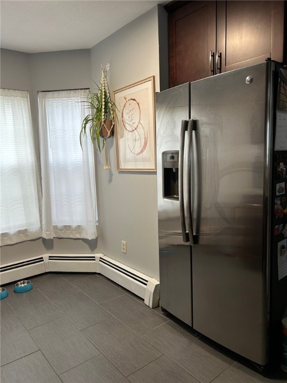 565 Quaker Ln Unit 101, West Warwick, RI 02893 - kitchen featuring stainless steel fridge with ice dispenser and dark brown cabinetry