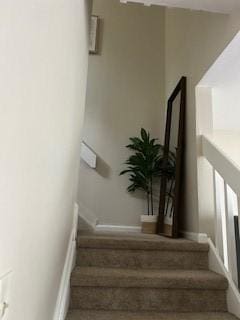 565 Quaker Ln Unit 101, West Warwick, RI 02893 - stairway featuring baseboards