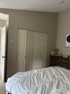565 Quaker Ln Unit 101, West Warwick, RI 02893 - bedroom featuring a closet and carpet flooring