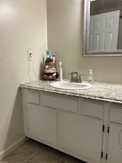 565 Quaker Ln Unit 101, West Warwick, RI 02893 - bathroom featuring vanity and tile patterned flooring