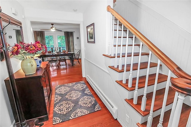 60 Tower Hill Rd, Tiverton, RI 02878 - stairway with a baseboard radiator, wood finished floors, ceiling fan, and a decorative wall