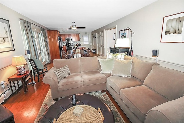 60 Tower Hill Rd, Tiverton, RI 02878 - living area featuring wood finished floors, ceiling fan, and a baseboard heating unit