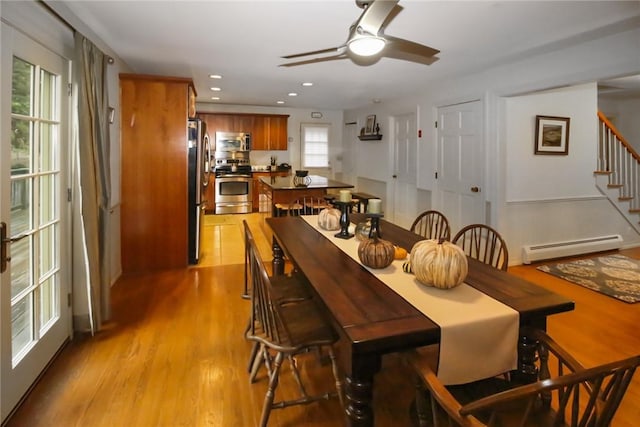 60 Tower Hill Rd, Tiverton, RI 02878 - dining space featuring a baseboard heating unit, stairway, light wood-type flooring, ceiling fan, and recessed lighting