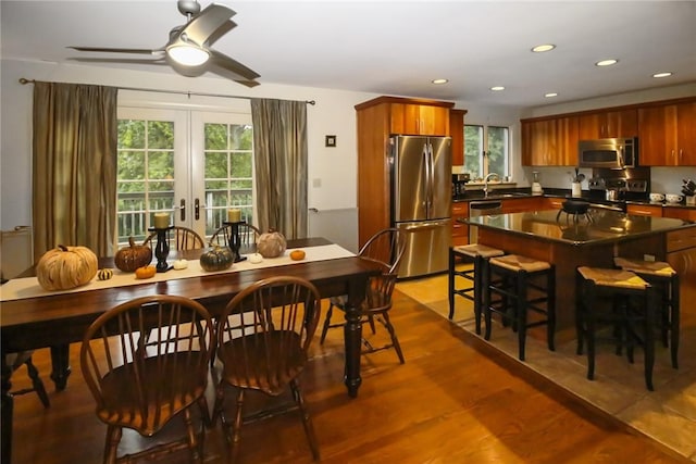 60 Tower Hill Rd, Tiverton, RI 02878 - kitchen with stainless steel appliances, dark countertops, a ceiling fan, recessed lighting, and a center island