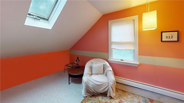 60 Tower Hill Rd, Tiverton, RI 02878 - living area with a baseboard heating unit, vaulted ceiling, a skylight, and carpet floors
