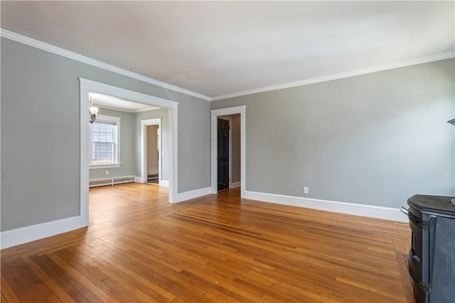 68 Friendly Rd, Cranston, RI 02910 - unfurnished living room with crown molding, wood-type flooring, a chandelier, baseboard heating, and a wood stove