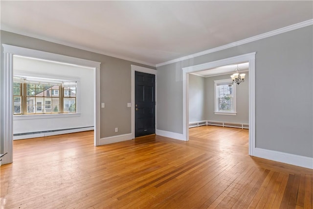 68 Friendly Rd, Cranston, RI 02910 - spare room with baseboard heating, a chandelier, light wood-type flooring, and crown molding
