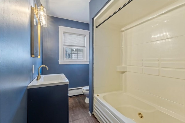 68 Friendly Rd, Cranston, RI 02910 - full bath featuring a baseboard radiator, vanity, wood finished floors, and a combined bath / shower with jetted tub