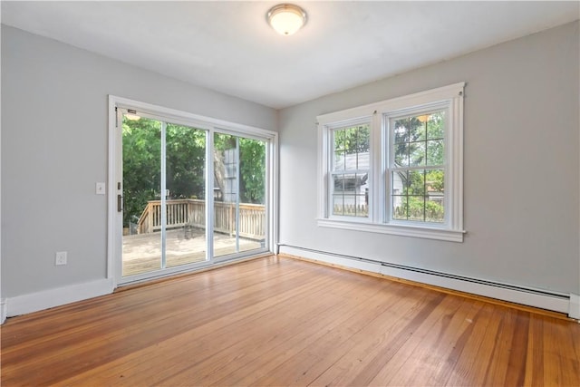 68 Friendly Rd, Cranston, RI 02910 - empty room featuring a baseboard radiator and hardwood / wood-style flooring