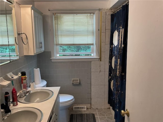 14 Jaycee Dr, West Warwick, RI 02893 - bathroom with double vanity, tile walls, a shower with curtain, and tile patterned floors