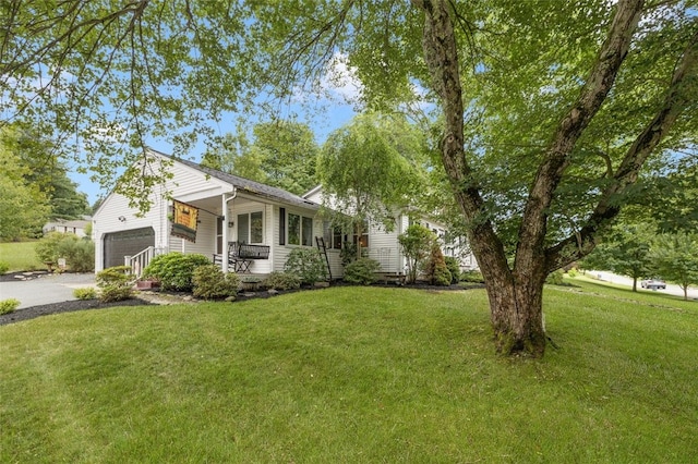 27 Nixon St, Cumberland, RI 02864 - view of front facade featuring a garage, a front lawn, asphalt driveway, and a porch