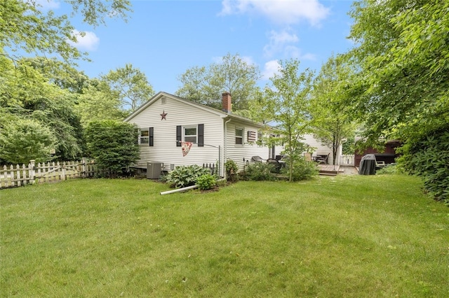 27 Nixon St, Cumberland, RI 02864 - back of house featuring a chimney and a deck